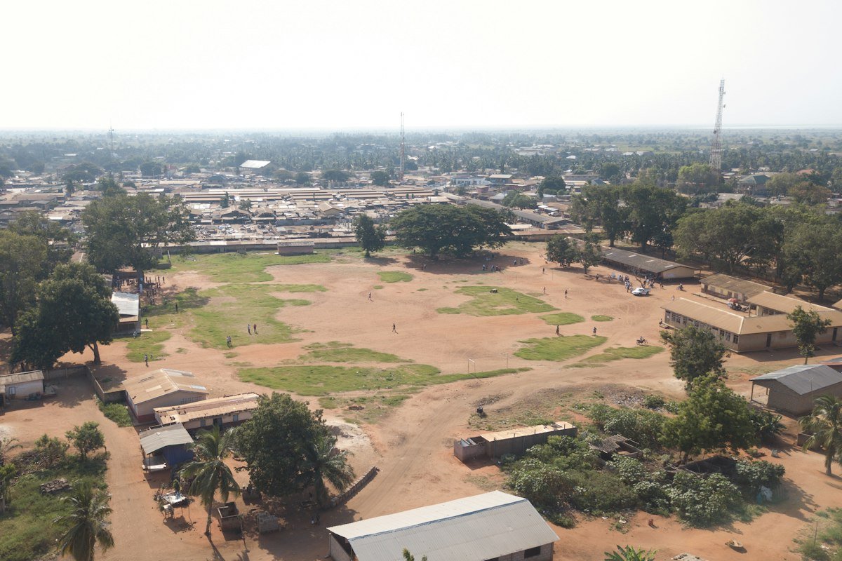 Goalposts and grass for the Ada school field